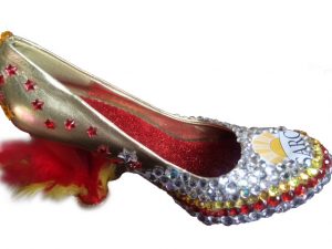 One of the four “bedazzled” shoe trophies created by SARC staff that will be presented after this year’s Walk a Mile in Her Shoes challenge.
