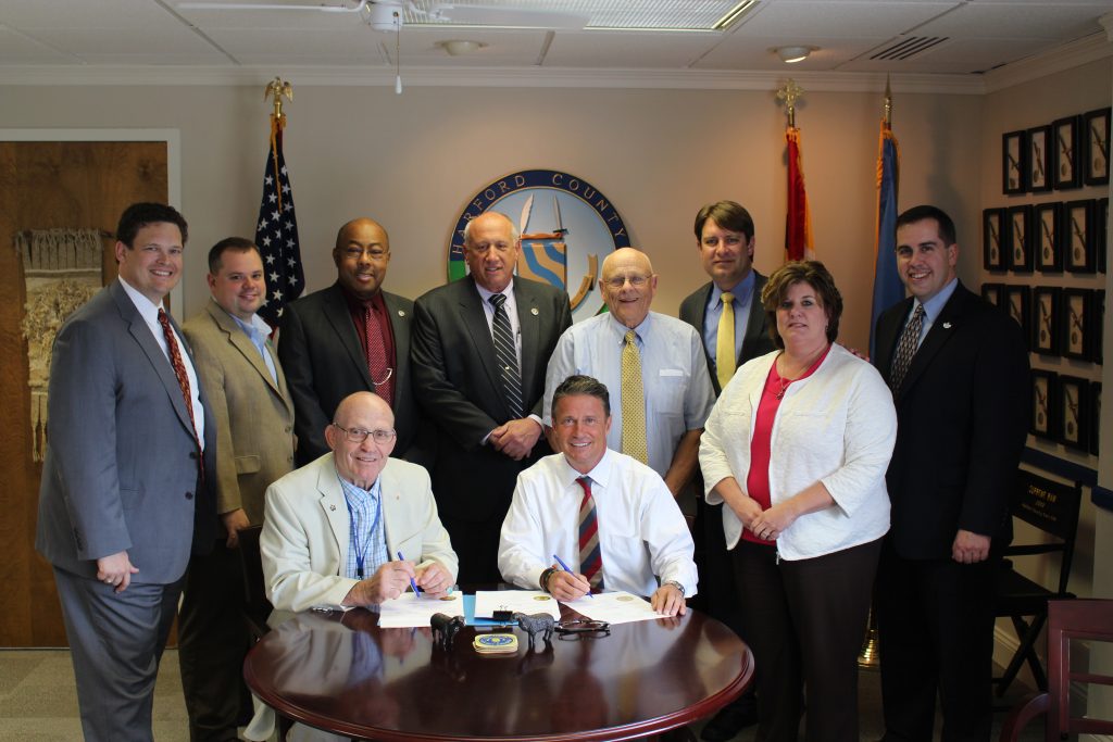 Photo caption: Seated, L to R: Council President Richard C. Slutzky, County Executive Barry Glassman Standing, L to R: County Treasurer Robert F. Sandlass, Councilman Joe Woods, Councilman Curtis L. Beulah, Councilman Patrick S. Vincenti, Councilman James “Capt’n Jim” McMahan, Councilman Chad Shrodes, County Budget Chief Kimberly K. Spence, Councilman Mike Perrone Jr.   