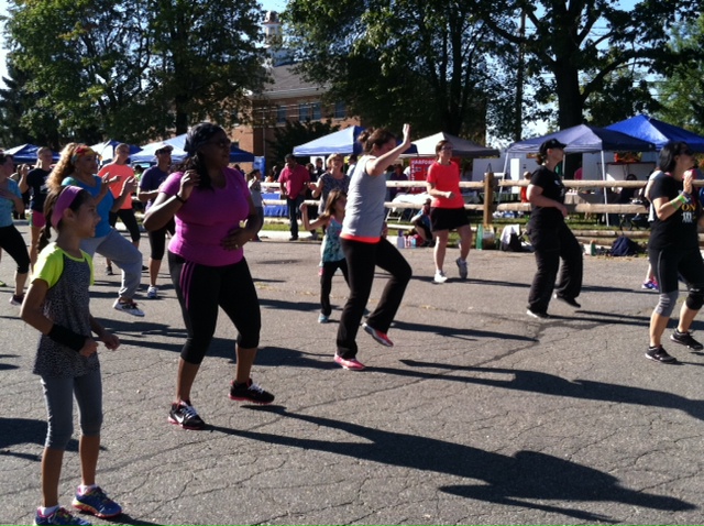 A crowd of attendees take part in a Zumba class at Healthy Harford Day 2014.