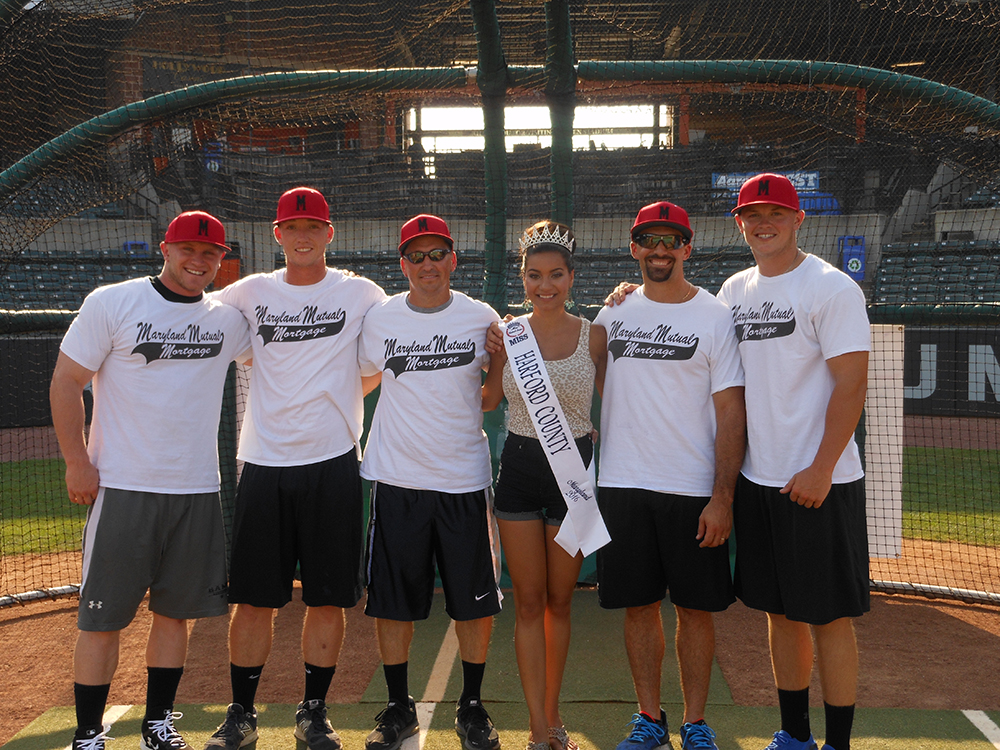 Miss Harford County, Allison Redman, poses with the champions of the home run derby, the team from Maryland Mutual Mortgage Company, who hit 12 home runs to earn 2,355 points. Left to right: Matt Wilson, Brett Hash, Mike Hughes, Miss Harford County, Allison Redman, Matt Gianni and Joe Harbach.