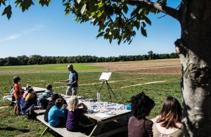 Watercolor artist Ken Karlic addresses a group of children during the children’s plein air painting demonstration at Broom’s Bloom Dairy. The event was part of the Harford County Plein Air Art Festival. Photo Credit: Bill Garvin, BG Photos
