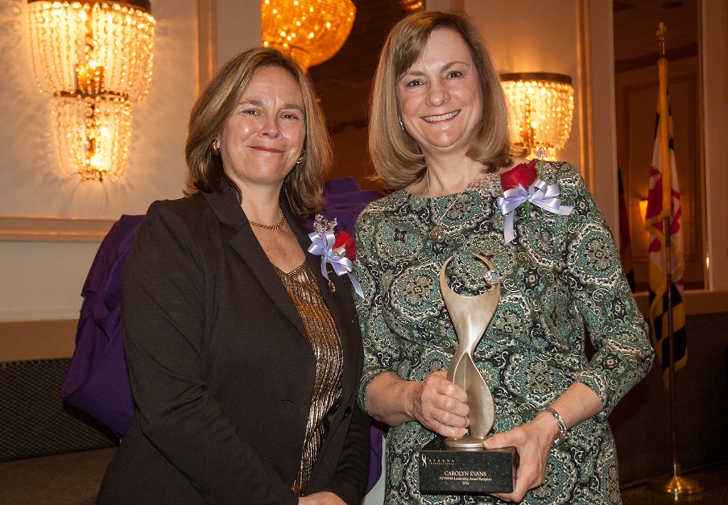 Stephanie Hau, president/CEO of Chesapeake Environmental Management and recipient of the 2015 ATHENA Award, presents this year's ATHENA Award to Carolyn Evans, partner at Sengstacke and Evans, LLC. (Photo by Lauren Ciambruschini/Harford Community College)