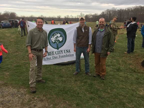 Pictured left to right, Harford County Executive Barry Glassman; Ben Lloyd, president of the Harford Land Trust Board; and Brad Killian, director of the Harford County Dept. of Planning & Zoning join volunteers planting 200 trees on Harford Land Trust property in Edgewood to celebrate Arbor Day. Harford County was named a 2015 Tree City USA by the Arbor Day Foundation in honor of its commitment to effective urban forest management.  (Photo credit: Harford County government)