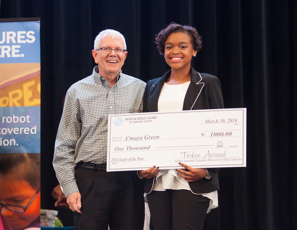 Torben Aarsand, Executive Director of A STEP 2 Success (right), presents Boys & Girls Clubs Harford County 2016 Youth of the Year, A'maya Green with a $1,000 Scholarship. 