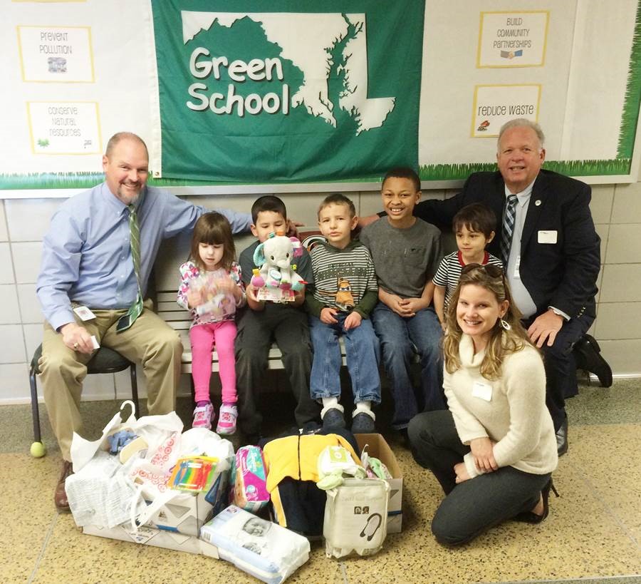 Students in Hickory Elementary School’s Patriot Program donating baby supplies to Harford County’s Project Healthy Delivery, which helps give newborns the best chance at a drug-free life. Pictured from left to right are Principal Brad Stinar; students Abby Landolt, Chris Medina, Miguel King, David Miles, and Bryson Diaz; Joe Ryan, manager of the Harford County Office of Drug Control Policy and (in front) Amber Shrodes, director of Harford County Community Services for County Executive Barry Glassman. 