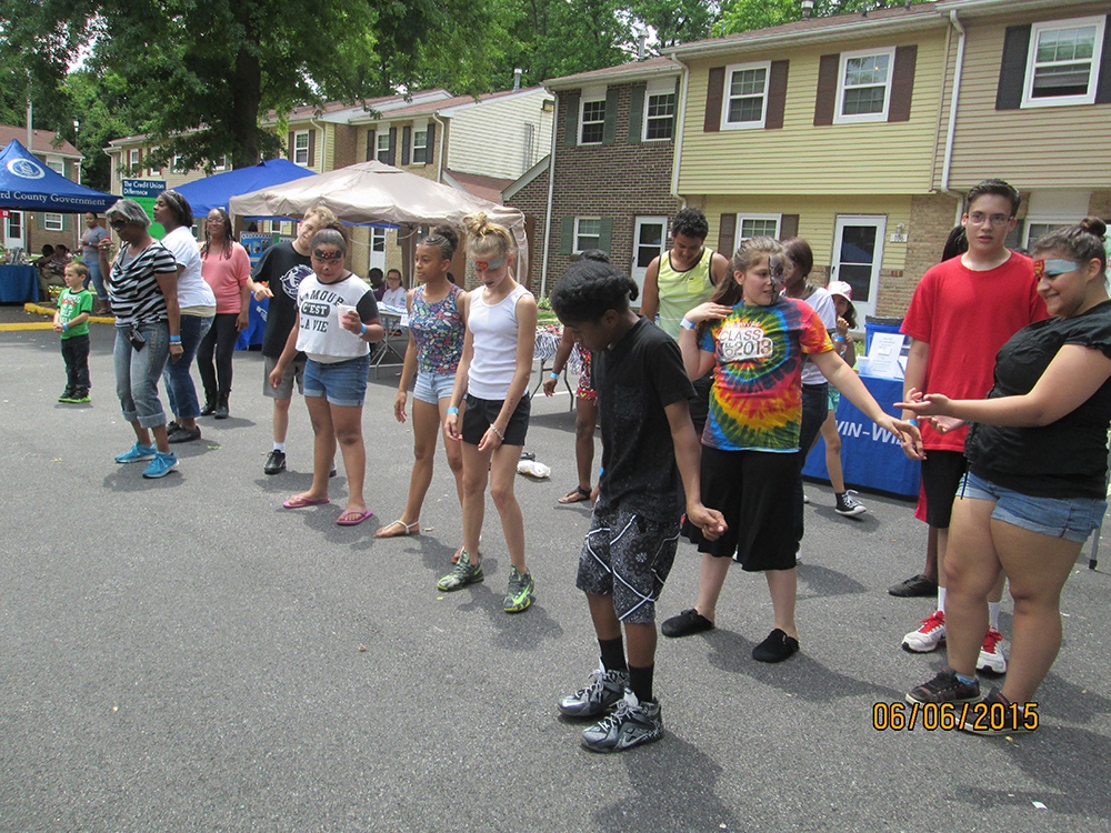 Attendees at the 2015 Summer Jam take part in a line dance.