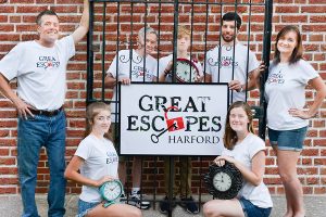 It’s hard to ‘escape’ this family business!  The Cole family of Harford County is opening Great Escapes Harford, the area’s first escape room venue, this month. All members of the family plus a few extras are involved with the business including: (front row) daughters Casey Cole (left) and Kirby Cole; (back row) dad Chris Cole, grandfather Joe Cole, son Cullen Cole, close family friend Mike Amoriello and mom Katie Cole.  Sister-in-law Jennifer Mullen (not pictured) is another employee. Great Escapes Harford is located at 2108 Emmorton Road in Bel Air.  Photos by Stacey Young, SKY Photography