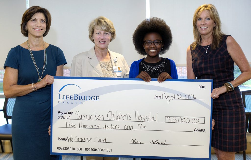 Abingdon resident Grace Callwood, founder of the We Cancerve Movement (second from right), presents a donation to Julie Cox, vice president of development for LifeBridge Health (second left) in support of a patient assistance fund to help cancer patients at Sinai Hospital. Joining the presentation are Jayne Klein, president of the Community Foundation of Harford County (left), and Brigitte Peters, the foundation's executive director. The donation was made through the We Cancerve Fund, an accumulator fund with the Community Foundation of Harford County. (Photo Courtesy of LifeBridge Health)
