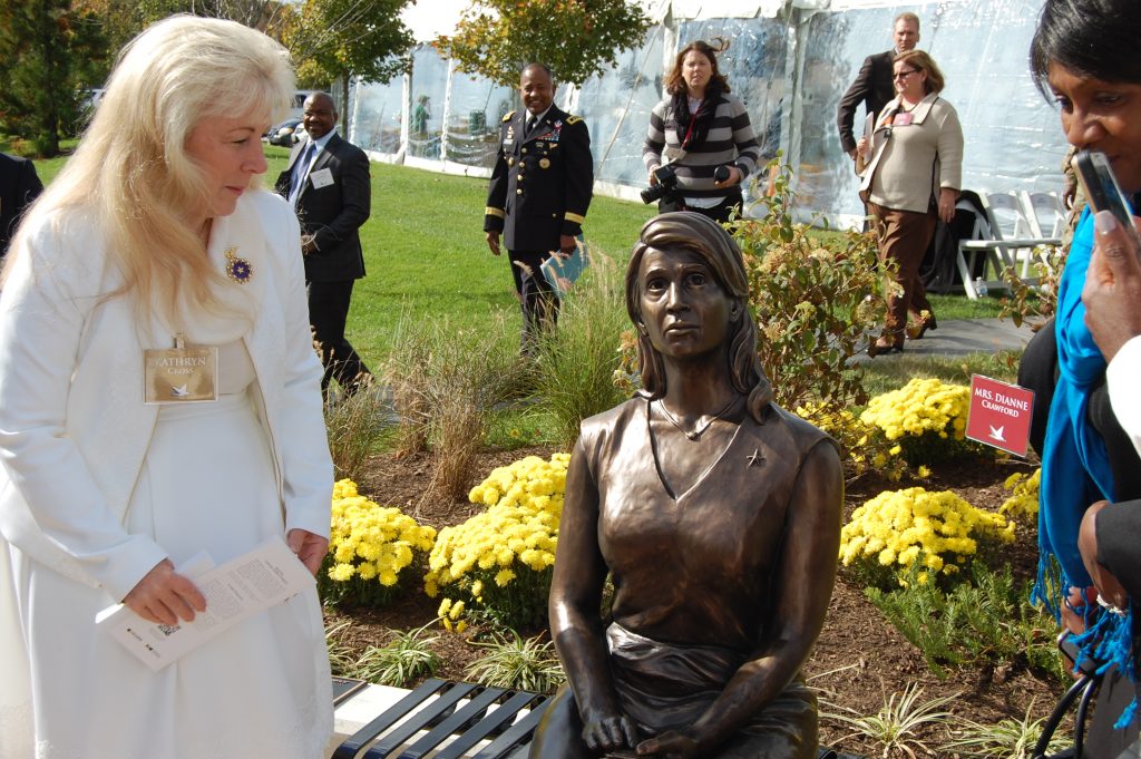 Gold Star Mother Kathryn Cross gets a closer look at the statue.