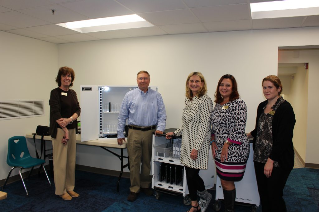 Miles Konopka, president/owner of Interactive Communications Research, Inc., presents two discovery carts to Beth LaPenotiere, manager, Bel Air Library (left); Mary Hastler, CEO, Harford County Public Library; Kristi Halford, foundation director, Harford County Public Library; and Jenny Novacescu, assistant branch manager, Bel Air Library. (Photo courtesy of Harford County Public Library)