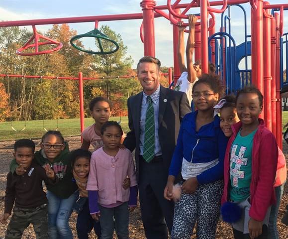 Harford County Executive Barry Glassman visiting with students in the after-school program re-established by his administration at the Edgewood Recreation and Community Center. Pictured from left: Daniel, Skye, Brionah, Megan, Randi (above Megan), County Executive Glassman, Ronni (on playground equipment), Zianna, Trinaty, Asjah