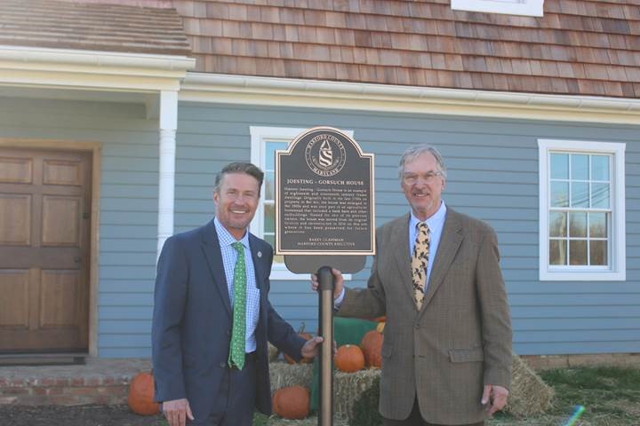 County Executive Barry Glassman, left, and preservationist and author C. John Sullivan Jr. celebrating the rededication of Harford County’s historic Joesting-Gorsuch House. Saved from demolition by the Glassman administration, the centuries-old house was disassembled at its original location in Bel Air and reassembled on county-owned property in Street, Md. 