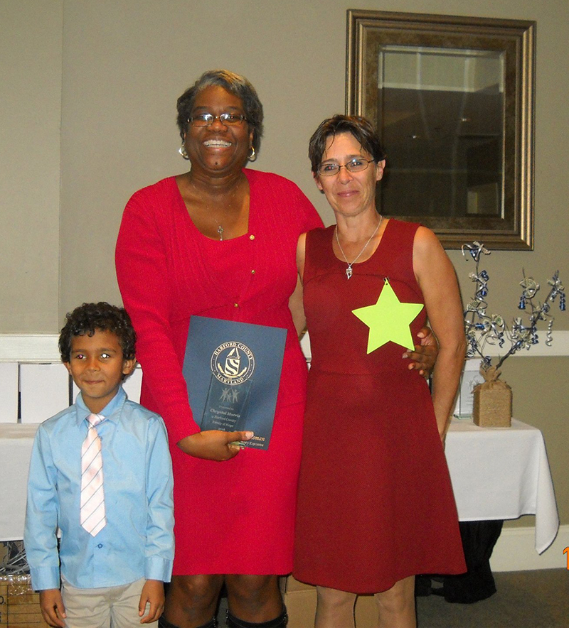 Nicki Biggs, Executive Director of The SUCCESS Project (left) presents Chrystal Morris (right) and her son with their award as top fundraisers for The SUCCESS Project Families of Hope Campaign. The award was presented  during the November 4 Gala of Hope held at Bulle Rock. The Gala was the grand finale of the Families of Hope Campaign, Harford County’s first inter-agency public awareness and fundraising collaborative.  