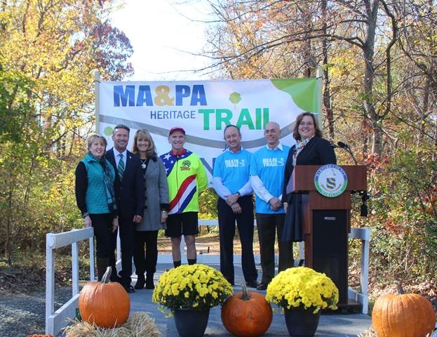 Pictured from left: Bel Air Mayor Susan Burdette; Harford County Executive Barry Glassman; Cindy Hooper Hushon; David Hooper; Ma & Pa Heritage Trail Foundation officials Philip Hosmer, president, and Rod Bourn, past president; Harford County Director of Parks & Recreation Kathy Burley