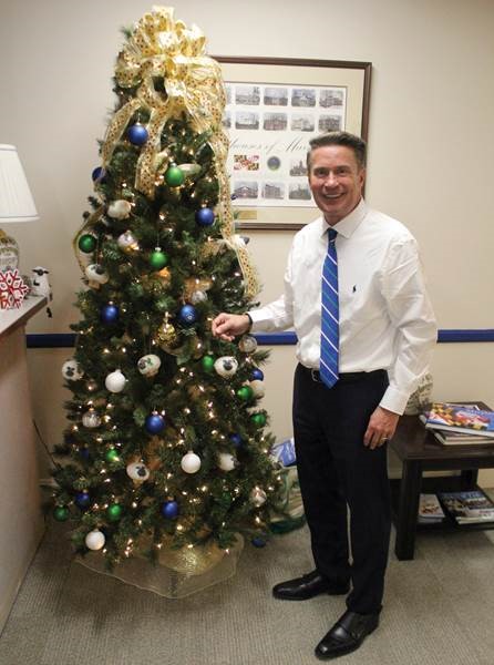 Harford County Executive Barry Glassman in his office with a Christmas tree featuring handmade sheep ornaments.