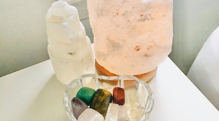 a nightstand with an assortment of crystals