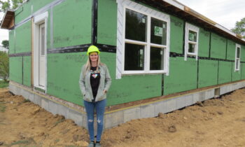 Habitat home built at the Cecil County School of Technology is transported to its final, permanent location in Elkton