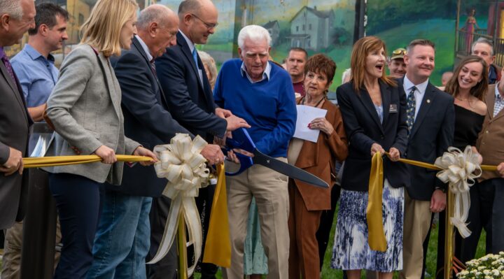 Harmer’s Town Art Center, Inc. president Allen Fair cuts the ribbon along with the help of elected officials and other dignitaries on Friday evening during the Graw Alley grand opening ceremony in Havre de Grace. (photo credit – Malgorzata Baker/Malgorzata Baker Photography)