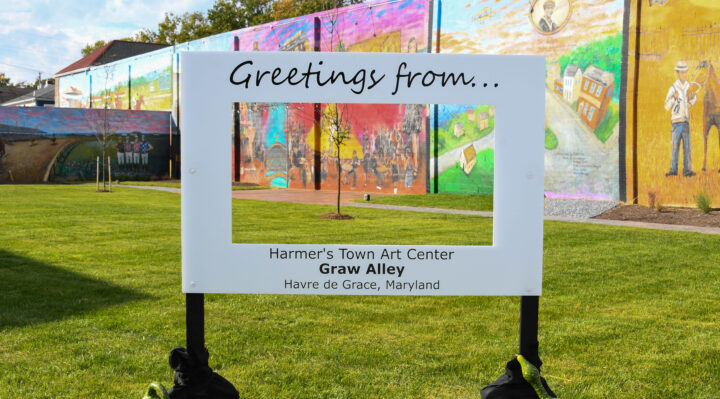 A selfie station frames the murals on Friday evening during the Graw Alley grand opening ceremony in Havre de Grace. (photo credit – Donna Harding/Donna Harding Photography)