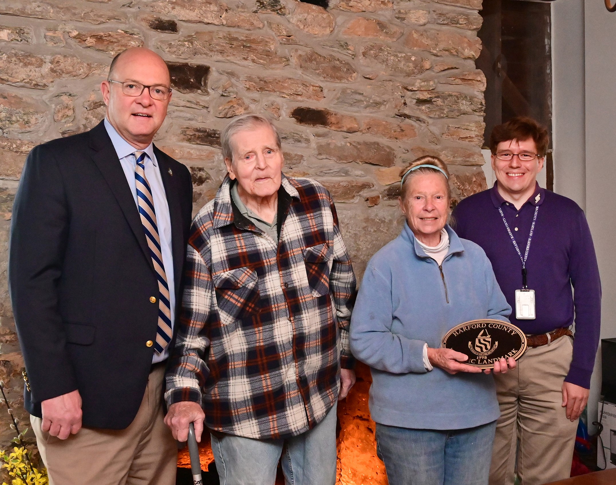 Harford County Executive Bob Cassilly, left, and Historic Preservation Planner Jacob Bensen, right, present Friendship Farm owners, Francis and Patricia Smith with a historic marker plaque to be displayed on their home during their visit to the farm Tuesday, November 21.