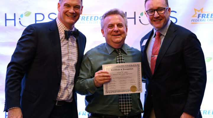 Dr. Sean Abel (center), Principal of Patterson Mill Middle and High School, stands with Superintendent Bulson and Board of Education President, Aaron Poynton. Abel is one of 67 HCPS employees who received special recognition for 30 years of dedicated service. Courtesy HCPS